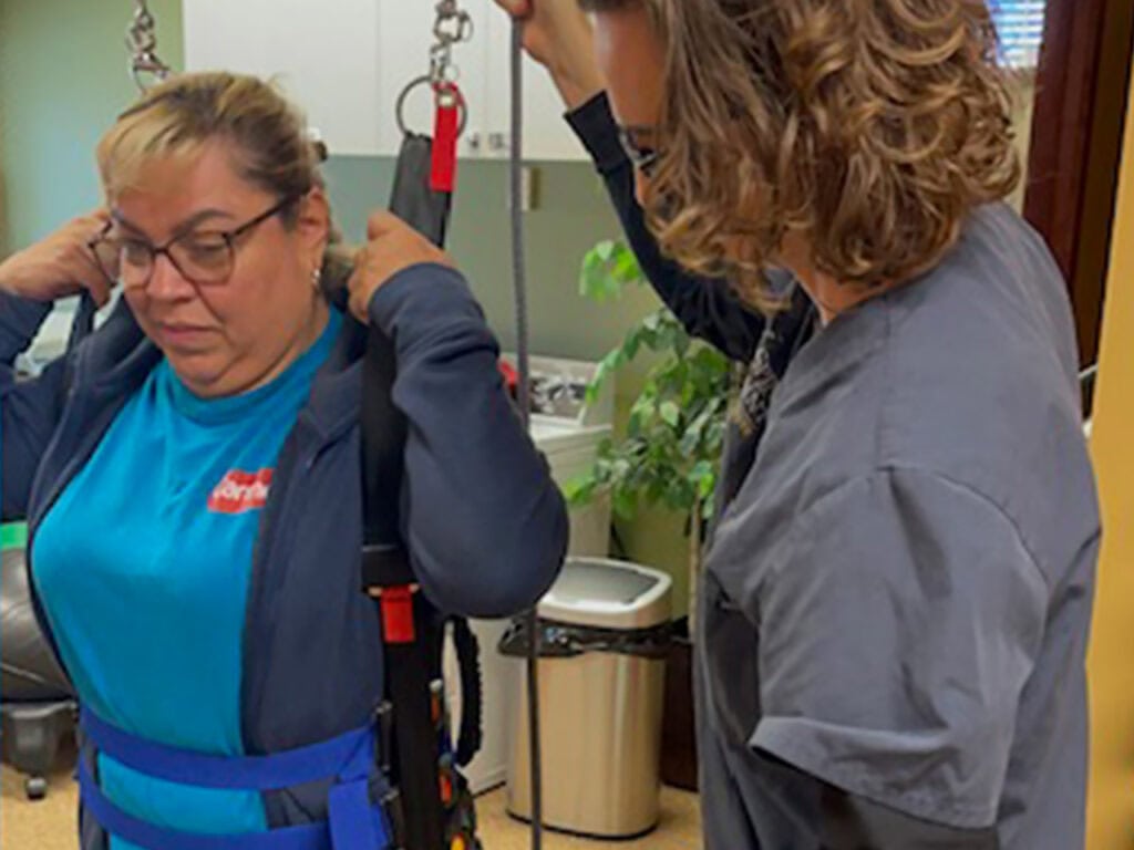Client getting physical therapy using an unweighing system