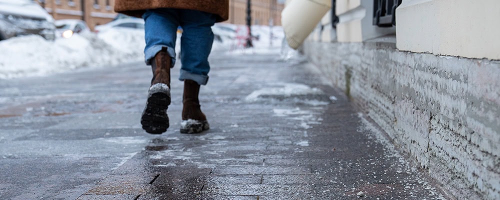 woman walking on an icy walkway