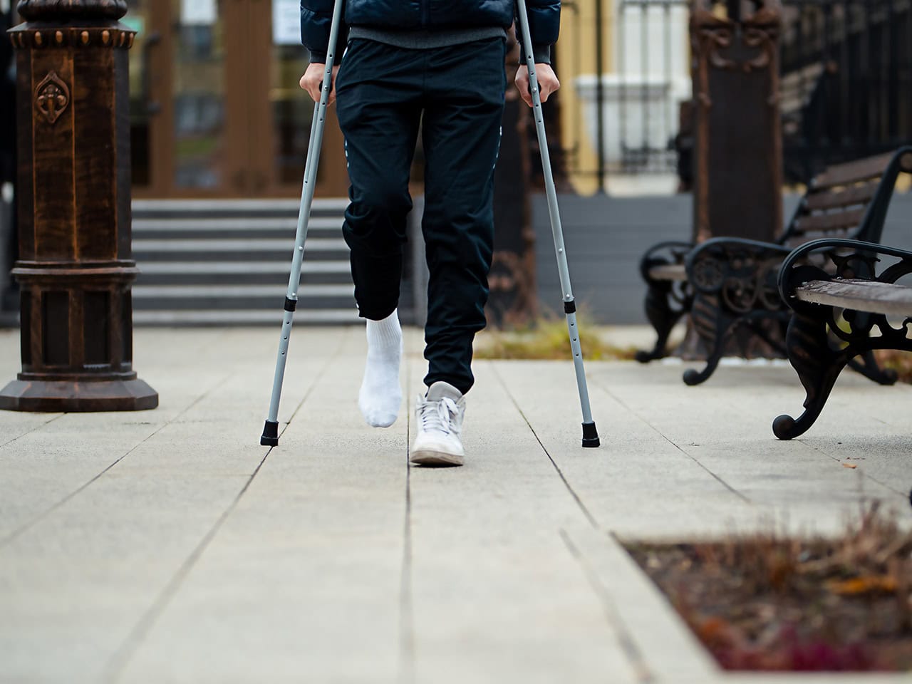 young man on crutches