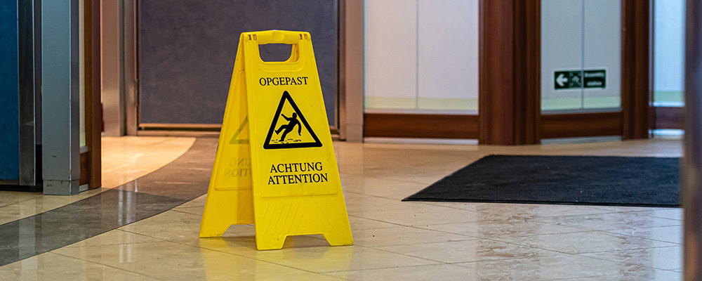 wet floor sign inside of a business
